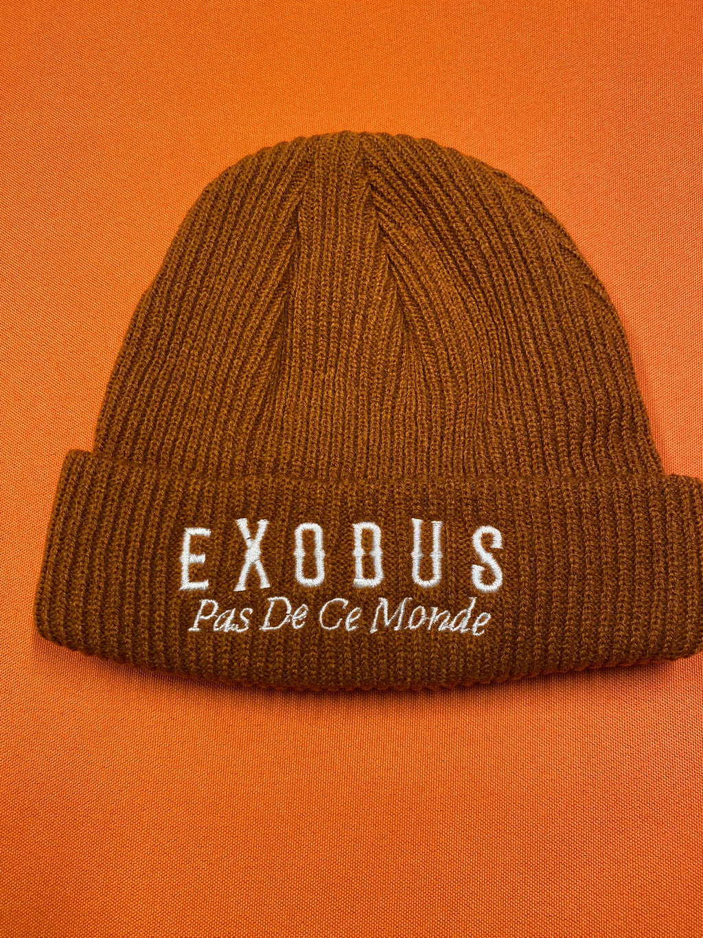 Clothing and accessories from Exodus Pas De Ce Monde – unisex streetwear including t-shirts, jackets, sunglasses, jewelry, bags, and headwear designed for everyday wear and bold urban fashion.