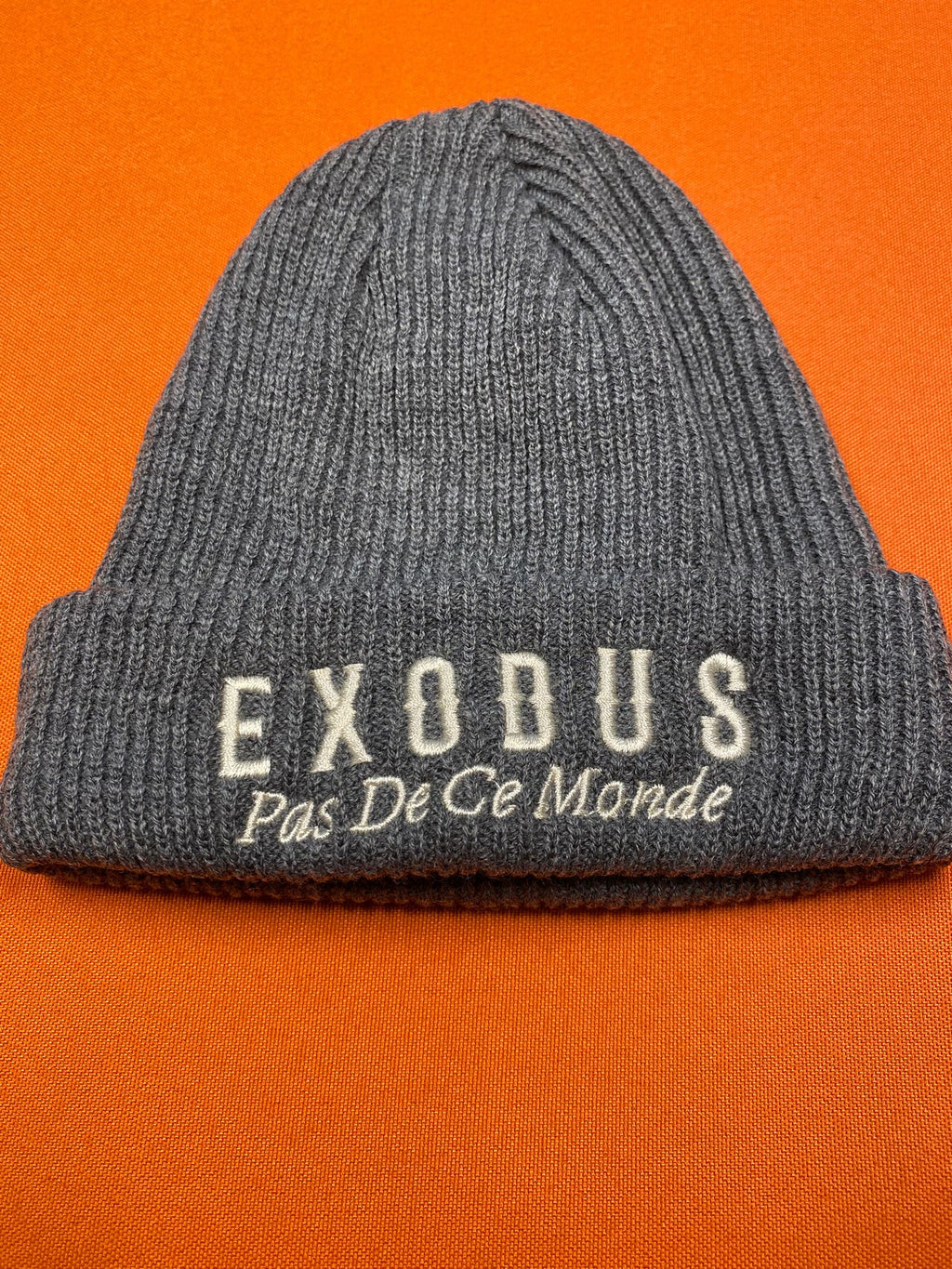 Clothing and accessories from Exodus Pas De Ce Monde – unisex streetwear including t-shirts, jackets, sunglasses, jewelry, bags, and headwear designed for everyday wear and bold urban fashion.