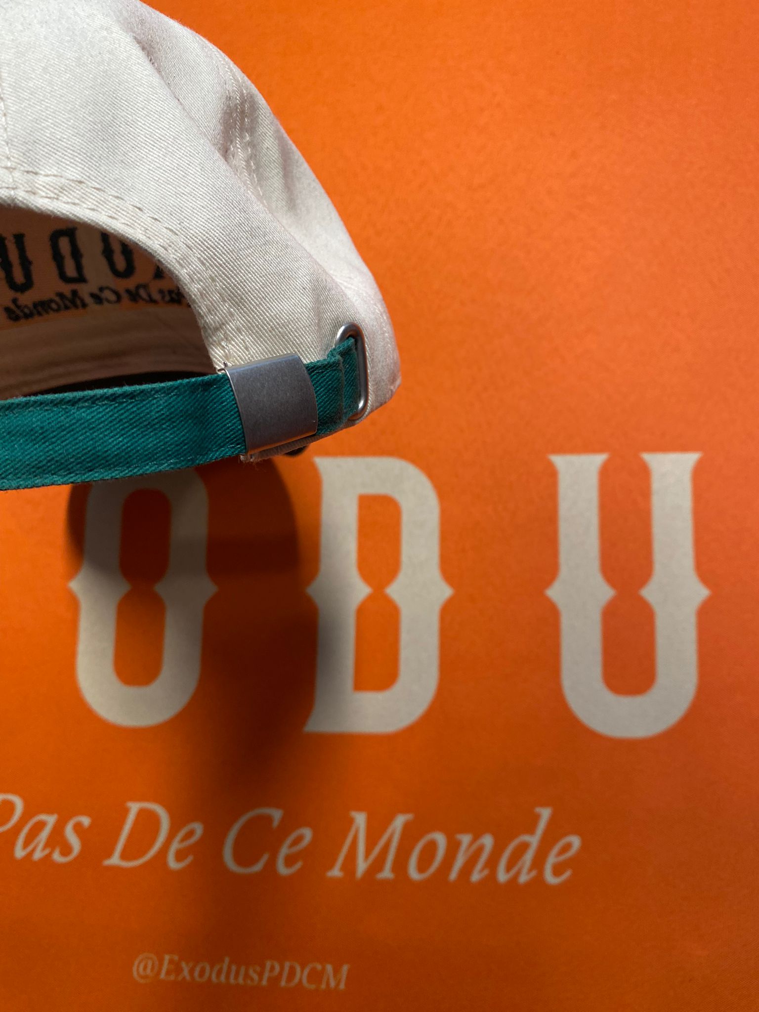 Clothing and accessories from Exodus Pas De Ce Monde – unisex streetwear including t-shirts, jackets, sunglasses, jewelry, bags, and headwear designed for everyday wear and bold urban fashion.