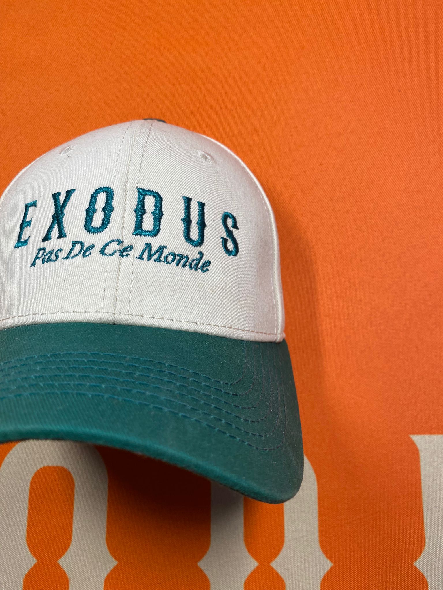 Clothing and accessories from Exodus Pas De Ce Monde – unisex streetwear including t-shirts, jackets, sunglasses, jewelry, bags, and headwear designed for everyday wear and bold urban fashion.