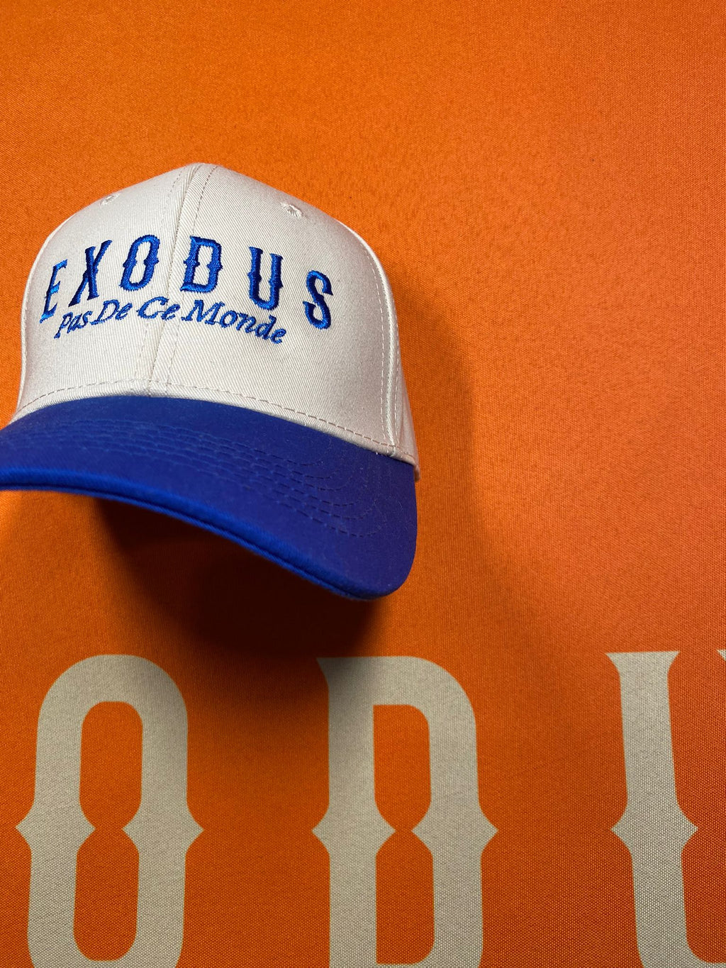Clothing and accessories from Exodus Pas De Ce Monde – unisex streetwear including t-shirts, jackets, sunglasses, jewelry, bags, and headwear designed for everyday wear and bold urban fashion.