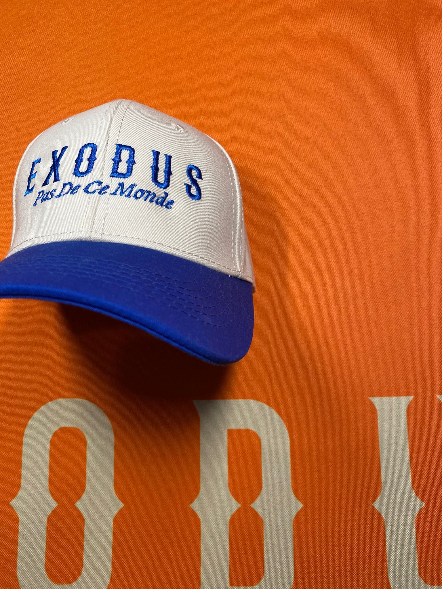 Clothing and accessories from Exodus Pas De Ce Monde – unisex streetwear including t-shirts, jackets, sunglasses, jewelry, bags, and headwear designed for everyday wear and bold urban fashion.