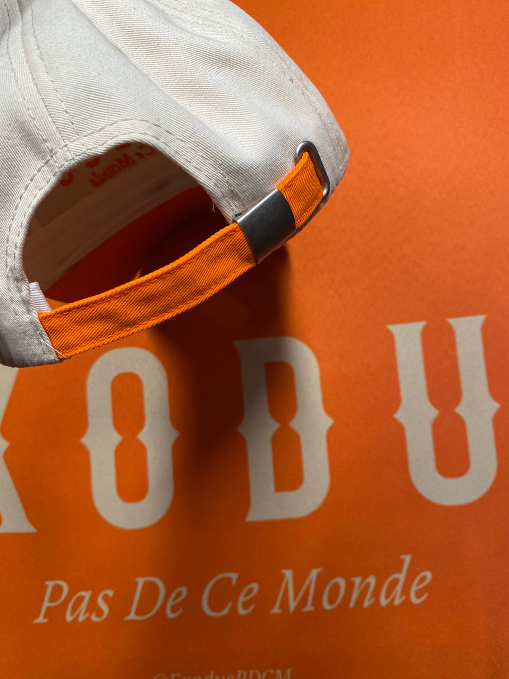 Clothing and accessories from Exodus Pas De Ce Monde – unisex streetwear including t-shirts, jackets, sunglasses, jewelry, bags, and headwear designed for everyday wear and bold urban fashion.