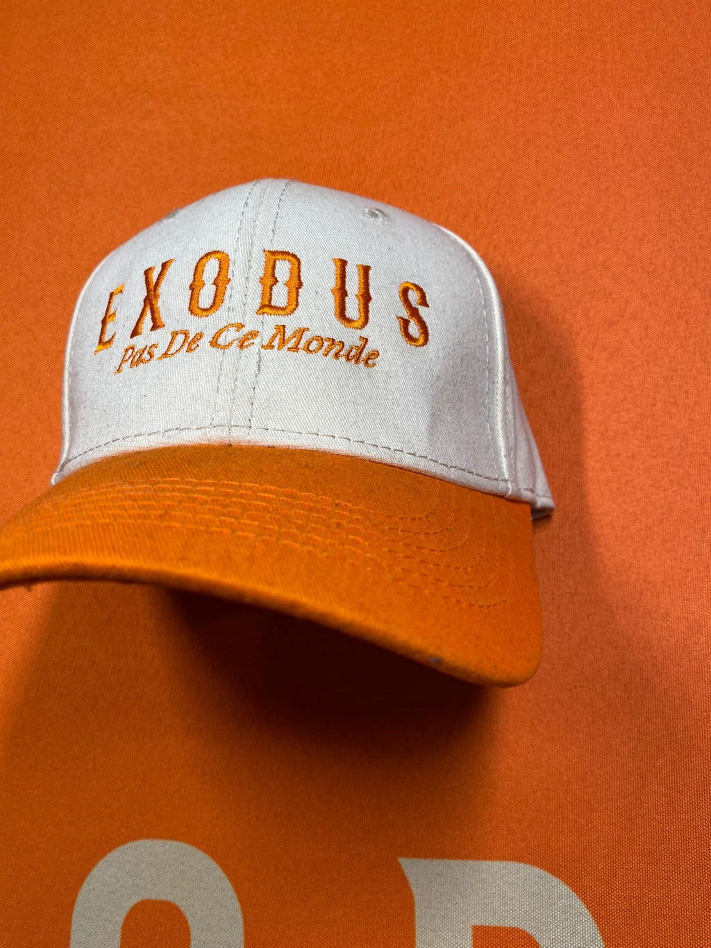 Clothing and accessories from Exodus Pas De Ce Monde – unisex streetwear including t-shirts, jackets, sunglasses, jewelry, bags, and headwear designed for everyday wear and bold urban fashion.