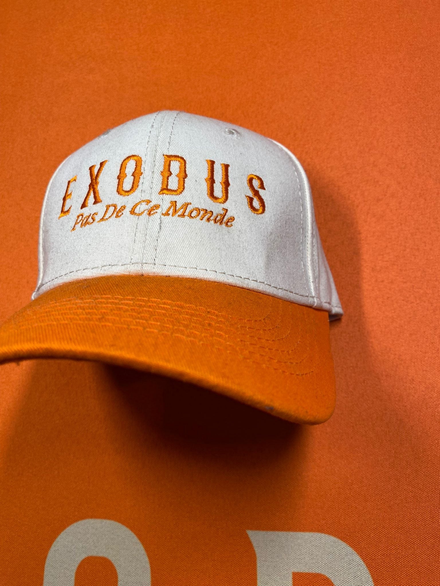 Clothing and accessories from Exodus Pas De Ce Monde – unisex streetwear including t-shirts, jackets, sunglasses, jewelry, bags, and headwear designed for everyday wear and bold urban fashion.