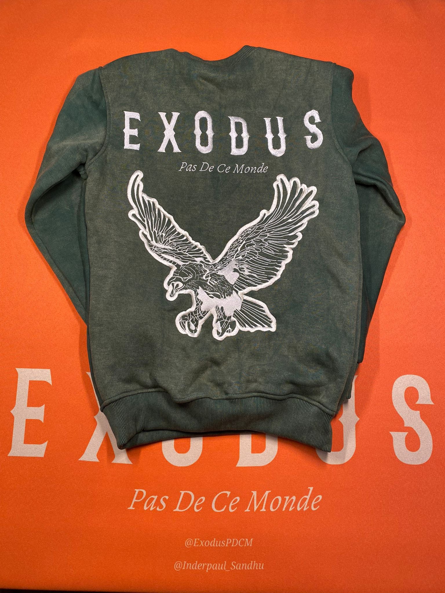 Clothing and accessories from Exodus Pas De Ce Monde – unisex streetwear including t-shirts, jackets, sunglasses, jewelry, bags, and headwear designed for everyday wear and bold urban fashion.