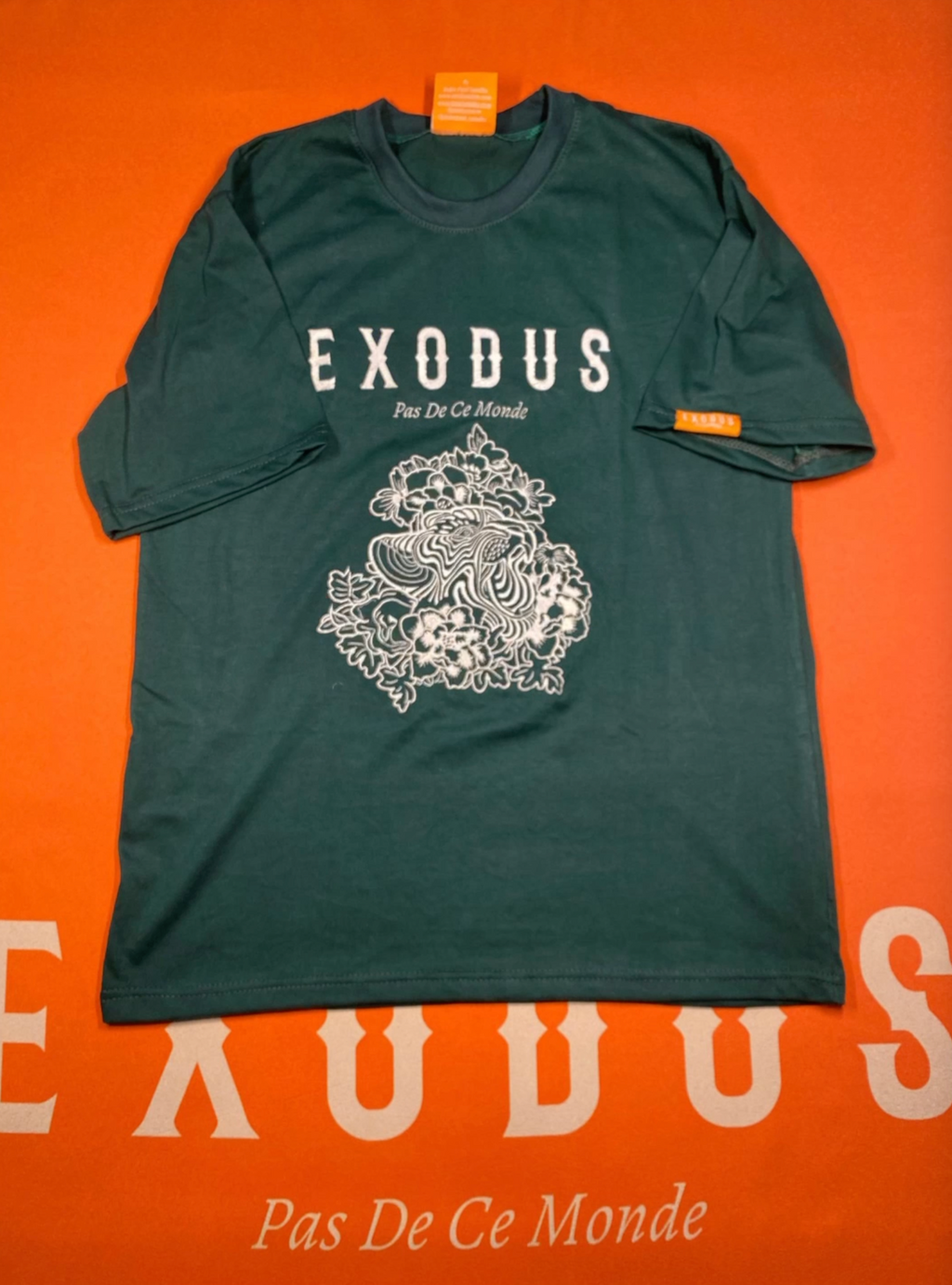 Clothing and accessories from Exodus Pas De Ce Monde – unisex streetwear including t-shirts, jackets, sunglasses, jewelry, bags, and headwear designed for everyday wear and bold urban fashion.