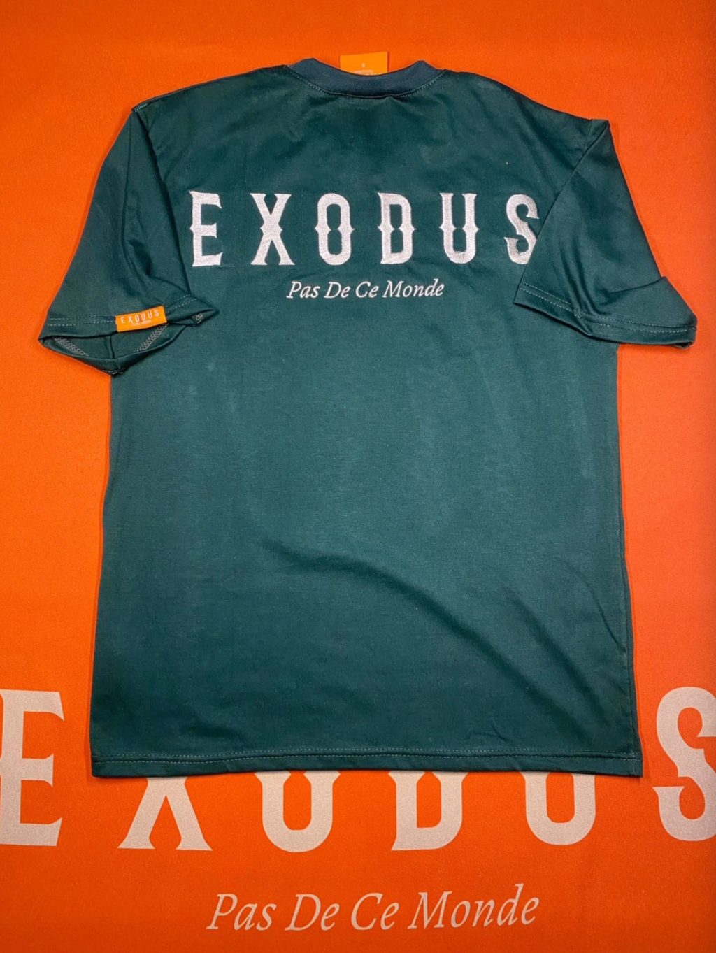 Clothing and accessories from Exodus Pas De Ce Monde – unisex streetwear including t-shirts, jackets, sunglasses, jewelry, bags, and headwear designed for everyday wear and bold urban fashion.