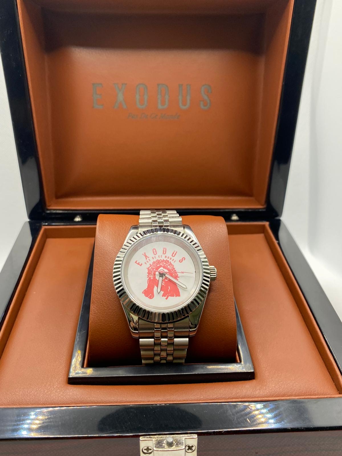 Clothing and accessories from Exodus Pas De Ce Monde – unisex streetwear including t-shirts, jackets, sunglasses, jewelry, bags, and headwear designed for everyday wear and bold urban fashion.